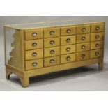 An early/mid-20th century oak framed haberdashery counter, the top with an applied brass measure