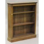 A late Victorian mahogany open bookcase, with overall crossbanded borders, the dentil moulded