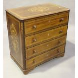 A 19th century Continental mahogany chest of four long drawers with inlaid decoration, on bracket