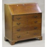 A late Victorian mahogany bureau, the fall flap revealing pigeonholes and drawers above four