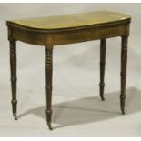 A George III mahogany fold-over card table, the top crossbanded in rosewood above an inlaid