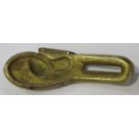 A Sino-Tibetan gilt bronze Buddha's or bodhisattva's ear, late Ming dynasty, length 20cm (formerly