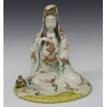 A Japanese Kutani porcelain figure of Kannon, Meiji period, modelled seated, her robe with enamelled