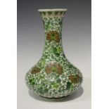 A Chinese famille verte porcelain bottle vase, late Qing dynasty, the low bellied body and flared