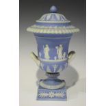 A Wedgwood pale blue dip jasper two handled vase and cover, 19th century, the campana shaped body