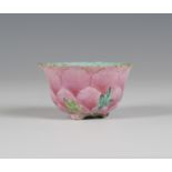 A Chinese famille rose enamelled porcelain libation cup, Qing dynasty, modelled as a pink peony