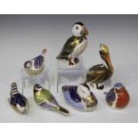 A group of seven Royal Crown Derby porcelain bird paperweights, comprising Robin, Wren, Goldcrest,
