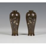 A pair of Japanese mixed metal inlaid brown patinated bronze vases by Nogawa, Meiji period, each