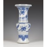 A Chinese blue and white porcelain beaker vase, Kangxi period, of shouldered trumpet form, painted