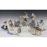 Nine Lladro porcelain figures, including Oriental Girl, No. 4840, Eskimo Rider, No. 5353, and Fox