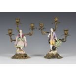 A pair of Derby porcelain ormolu mounted candelabra figures, late 18th century, modelled as a lady