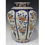 A Japanese Imari porcelain vase, early 18th century, of octagonal tapering form, each facet