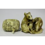 A Japanese carved ivory netsuke, Meiji period, finely modelled as two mice nibbling on a