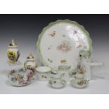 A Continental porcelain cabaret set, early 20th century, decorated with courting couples and