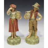 A pair of Robinson & Leadbeater tinted Parian figures of a Tyrolean boy and girl, circa 1890,