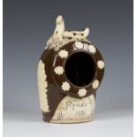 A Sussex slipware pottery salt pig, dated 1886, of typical shape, the brown glazed body with