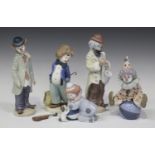 Four Lladro porcelain figures, comprising Pierrot with Puppy and Ball, No. 5278, Circus Sam, No.