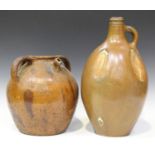 A large German stoneware salt glazed Bellarmine style jug, 19th century, of elongated bulbous