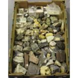 A large selection of mineral specimens, including astrophyllite, desert rose, obsidian, iron