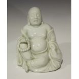 A Chinese blanc-de-Chine porcelain figure of a seated Buddha, probably 18th century, modelled seated