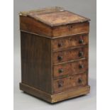 A Regency rosewood Davenport with gilt brass gallery, the hinged writing surface above four drawers,