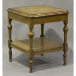 A late Victorian square centre table, the crossbanded top raised on turned and tapering legs