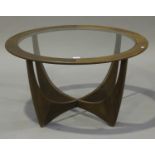 A G-Plan teak 'Astro' circular coffee table with glass top, height 46cm, diameter 84cm.Buyer’s