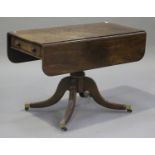 A Regency mahogany Pembroke table, fitted with two end drawers, raised on a turned column and