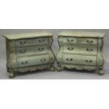 A pair of modern Rococo style blue painted bombé shaped chests of three drawers, on block legs,