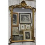 A 20th century French Rococo style giltwood wall mirror with shell and stiff leaf decoration,