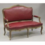 An early 20th century French walnut salon settee, height 105cm, width 140cm, depth 61cm, and two