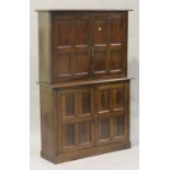 A late Victorian mahogany side cupboard, fitted with four panelled doors, on a plinth base, height