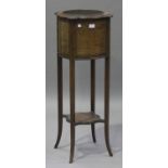 An Edwardian mahogany jardinière stand, the serpentine shaped body with chequer banded inlay and