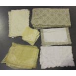 A quantity of whitework, including linen tablecloths, place mats and napkins.Buyer’s Premium 29.