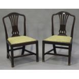 A set of six George III mahogany pierced splat back dining chairs with drop-in seats, on block legs,