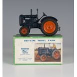 A Britains Model Farm No. 128F Fordson Major tractor with rubber tyres and driver, boxed with