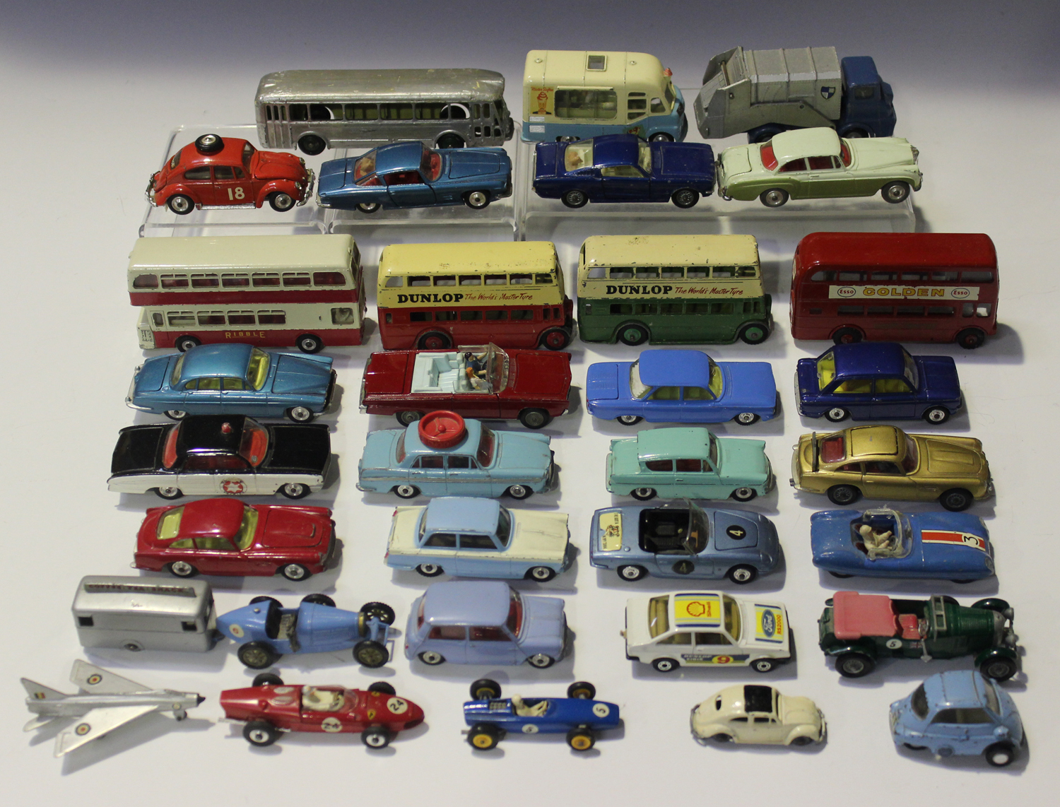 A collection of die-cast vehicles, including a Dinky Toys No. 290 double decker bus, a No. 292