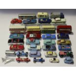 A collection of die-cast vehicles, including a Dinky Toys No. 290 double decker bus, a No. 292