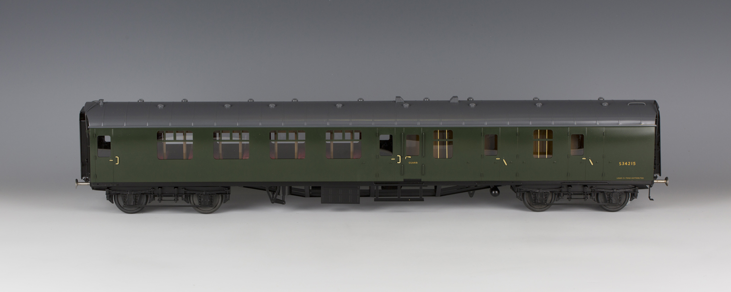 A Tower Brass by SanCheng gauge 1 1st class coach S3019, finished in green livery, and another coach