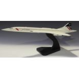 A Bravo Delta Models model of a Spitfire, length 36cm, wingspan 48cm, and a model of Concorde in