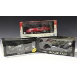 Six 1:18 scale AutoArt model cars, comprising a Steve McQueen Collection Jaguar XKSS, two Aston