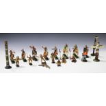 A collection of Elastolin figures of Native Americans, some on horseback, two cowboys and another