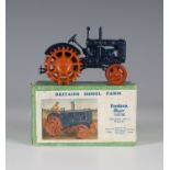 A Britains Model Farm No. 127F Fordson Major tractor with spudded metal wheels and driver, boxed