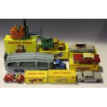 A small collection of Dinky Toys vehicles, including a No. 174 Hudson Hornet, finished in red and