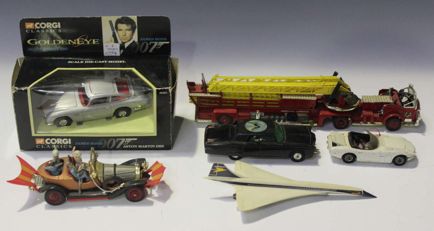 A collection of die-cast vehicles, including a Dinky Toys No. 153 Aston Martin DB6, a No. 132 Ford