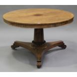 A Regency rosewood circular tip-top breakfast table, raised on a flared column and triform base with