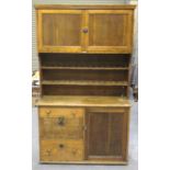 An early 20th century oak kitchen dresser by John Barker & Co Ltd, fitted with a pair of panelled