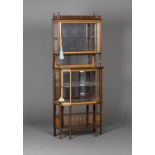 A late Victorian mahogany and satinwood crossbanded display cabinet of small proportions, in the