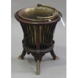 A late 19th century mahogany coal bucket of neoclassical form with gilt metal mounts, on outswept