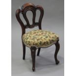 A late Victorian walnut framed child's chair with overstuffed seat, on cabriole legs, height 66cm,